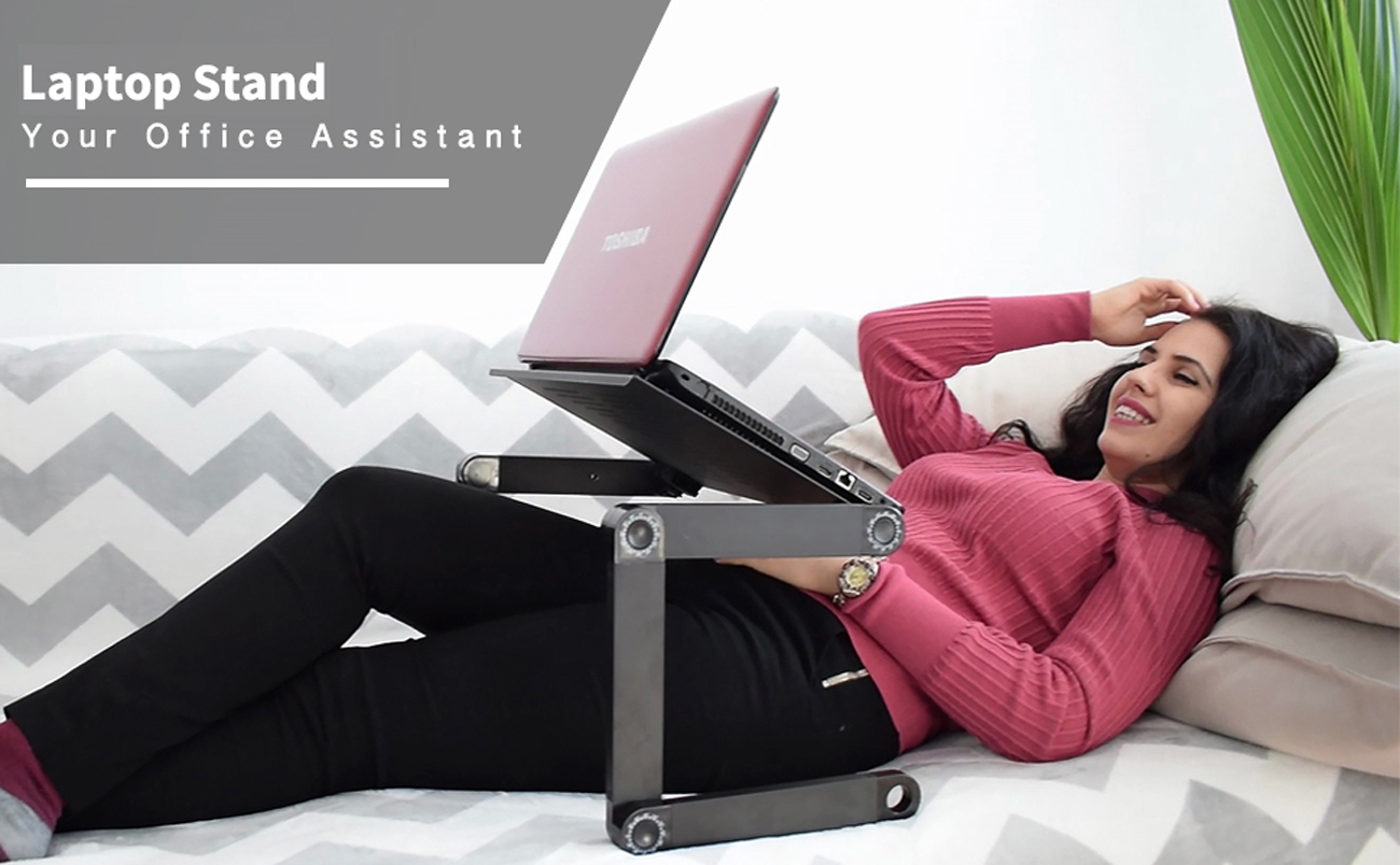 Hero Image: A woman is lying on the bed and using the laptop with this laptop stand